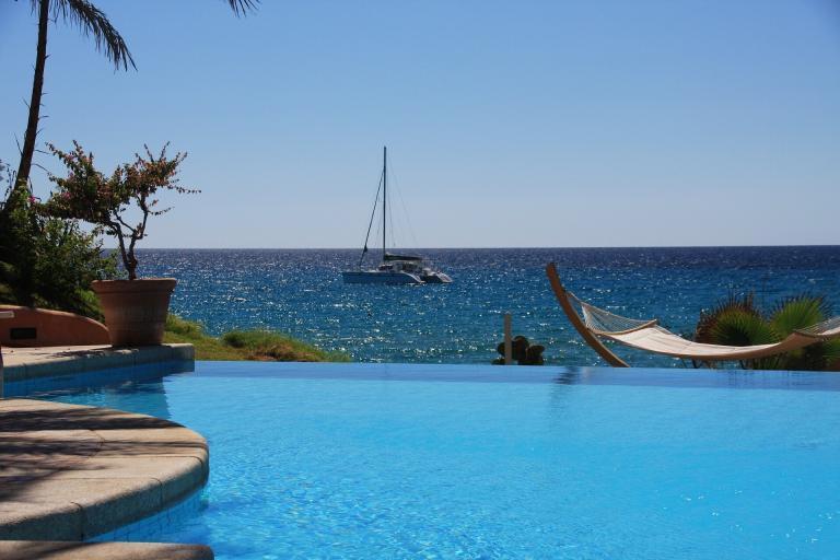 A Pool With A Sailboat In The Water
